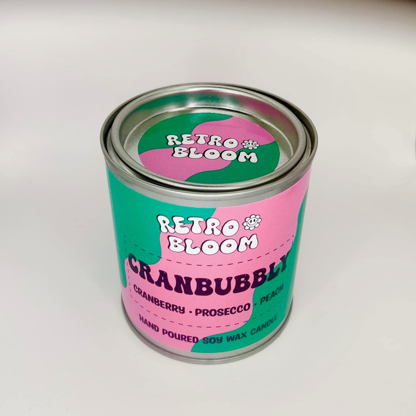 Cranbubbly candle in festive red tin – cranberry, prosecco, apple & musk soy wax candle by Retro Bloom
