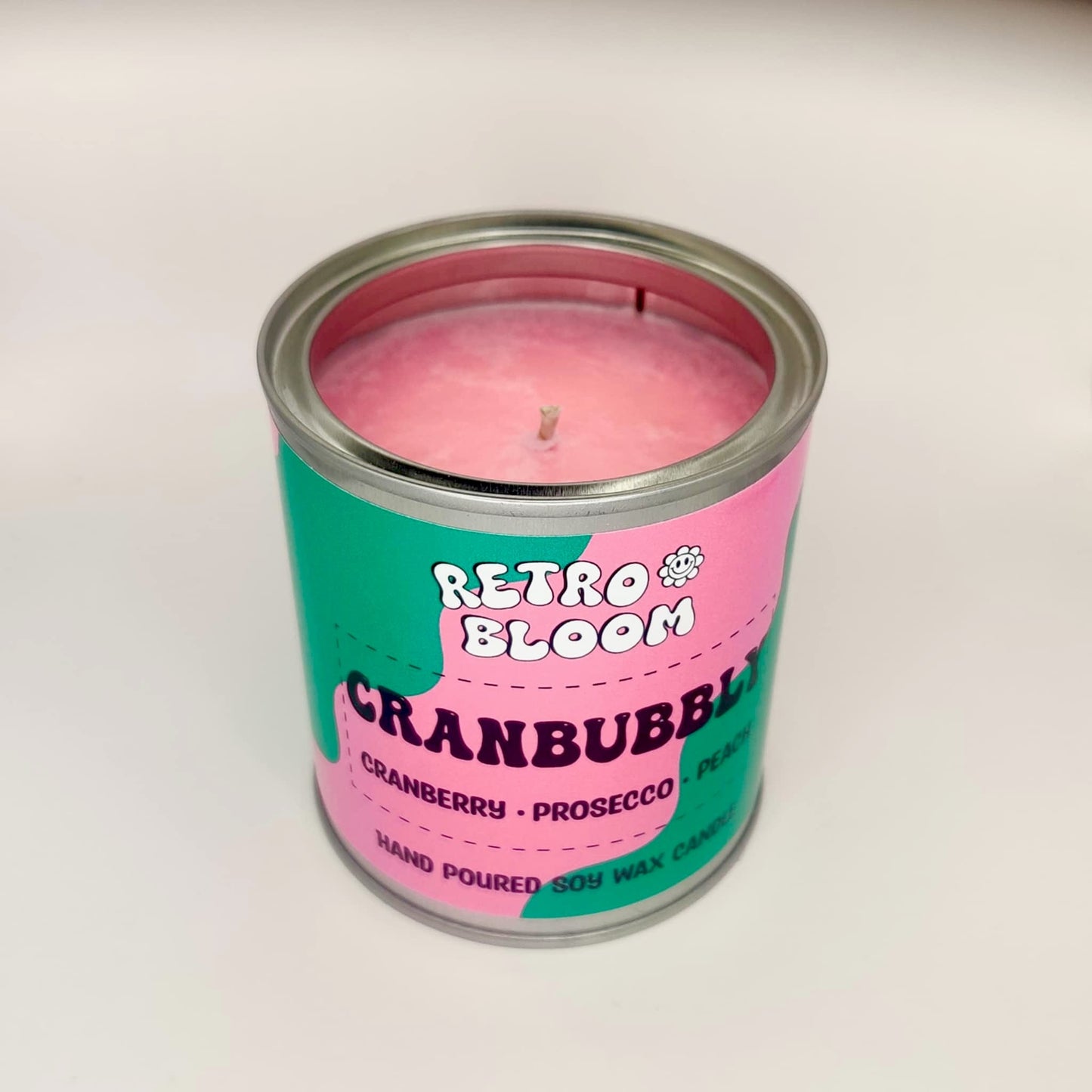 Cranbubbly candle in festive red tin – cranberry, prosecco, apple & musk soy wax candle by Retro Bloom