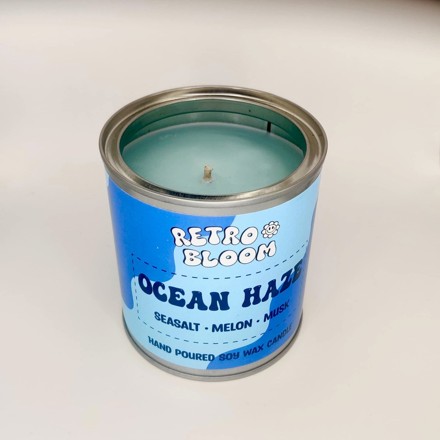 Ocean Haze candle in blue tin – fresh aquatic scented vegan soy wax candle by Retro Bloom