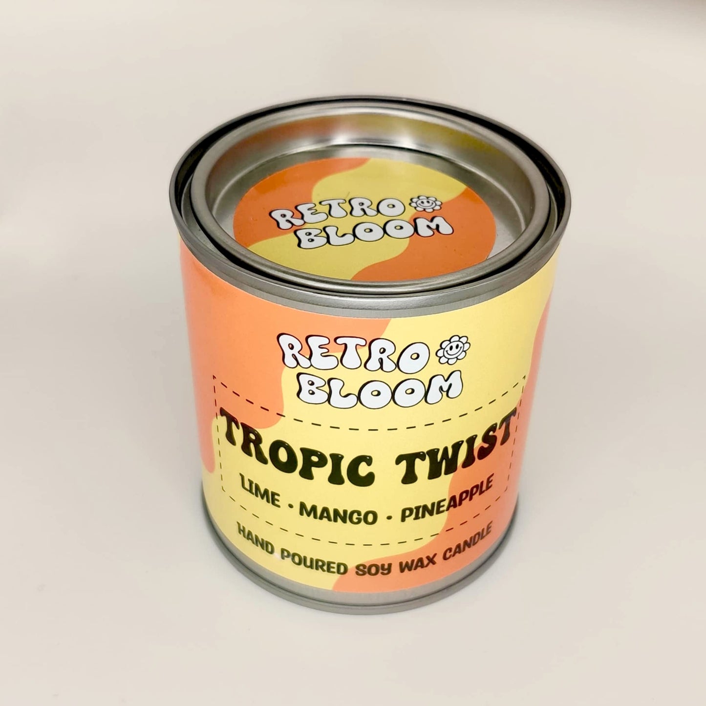 Retro Bloom Tropic Twist candle in bright tin – lime, mango, pineapple soy wax candle with zesty tropical scent