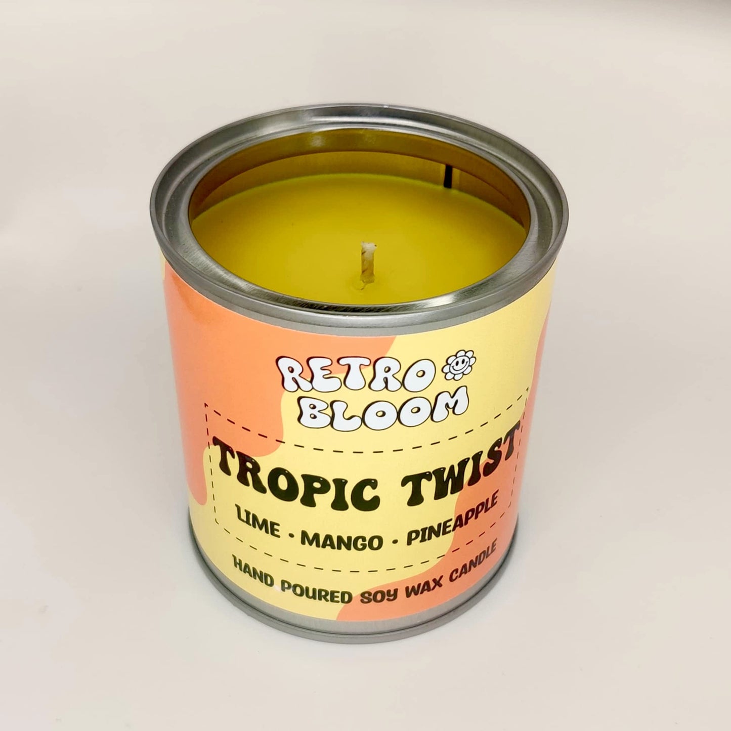 Retro Bloom Tropic Twist candle in bright tin – lime, mango, pineapple soy wax candle with zesty tropical scent