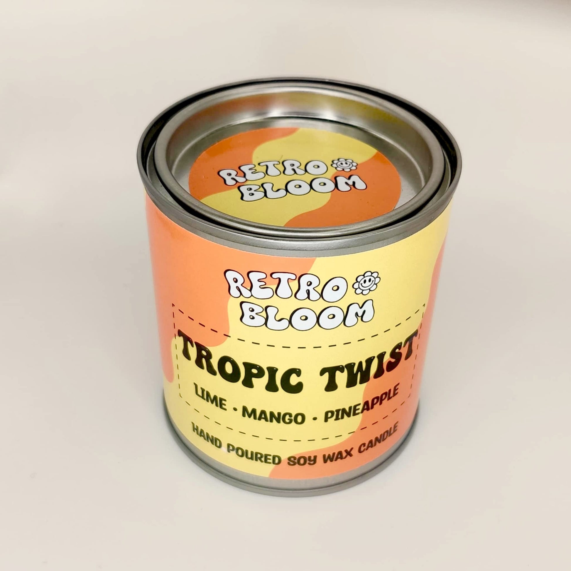 Retro Bloom Tropic Twist candle in bright tin – lime, mango, pineapple soy wax candle with zesty tropical scent