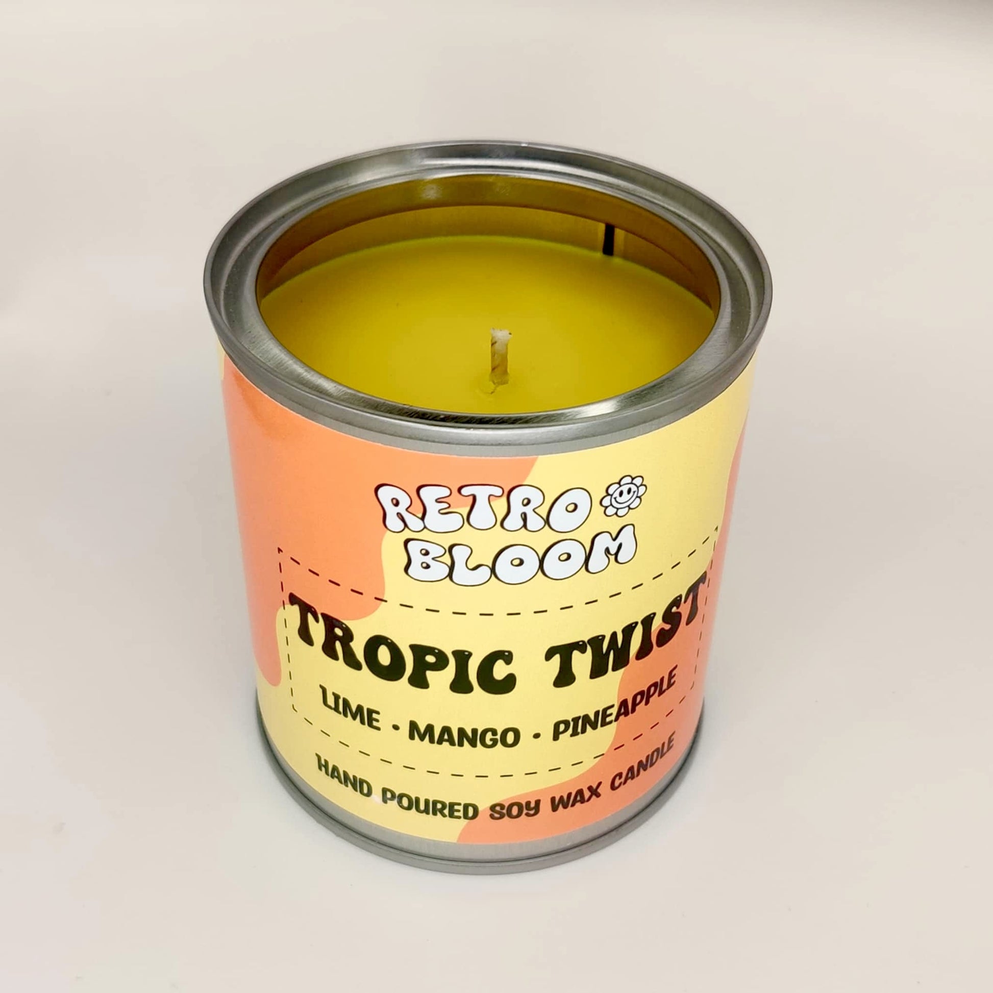 Retro Bloom Tropic Twist candle in bright tin – lime, mango, pineapple soy wax candle with zesty tropical scent